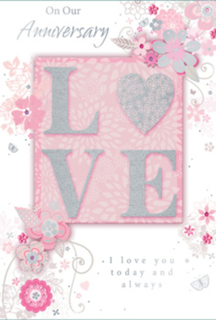 An anniversary card is shown in full, its design unfolding like a softly spoken love story crafted in shades of blush, cream, and silver, reminiscent of a gentle sunrise over Yeading's quiet residential streets. Dominating the centre is the word "LOVE," printed in bold, uppercase letters and finished with a raised layer of fine, shimmering glitter. The glitter appears evenly applied yet slightly textured, giving the impression that the letters would feel pleasantly rough under the fingertips, like the subtle grain of luxury cardstock. This central motif is placed on a panel of muted blush pink, set against a lighter pink background, creating a layered effect much like a bouquet arranged with different tones of the same flower. Surrounding the word, intricate illustrations of flowers, buds, and swirling leaves spread outward in looping arcs. These botanical details are stylized rather than realistic, with thin, graceful outlines in soft grey and white, lightly filled with washes of pale pink. Occasional silver accents trace the curves of petals and tendrils, catching the light as though the design had been kissed by frost. The blooms drift across the card in asymmetric clusters, with some nestling along the edges, while others curve around the letters, giving a sense of movement, as if a breeze were stirring a floral arrangement in a Yeading Florist display. Elegant script text, carefully spaced, conveys anniversary sentiments in a way that complements the artwork without crowding it. The overall feel is dreamy yet composed, evoking the warmth of long-lasting commitment and the quiet joy of marking another year together with a lovingly chosen card and flowers delivered locally in Yeading.